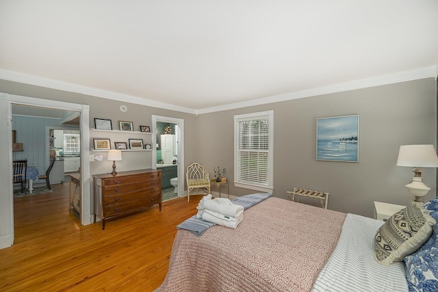 3206 Old Bainbridge Rd, Tallahassee, FL 32303 - bedroom featuring light wood finished floors and ornamental molding