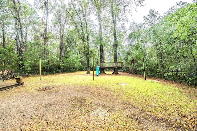 3206 Old Bainbridge Rd, Tallahassee, FL 32303 - view of yard featuring a wooden deck