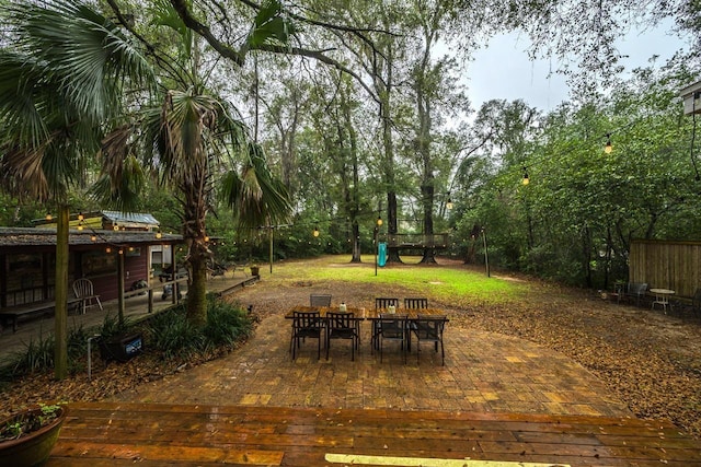 3206 Old Bainbridge Rd, Tallahassee, FL 32303 - view of yard with a patio area, outdoor dining area, and a playground