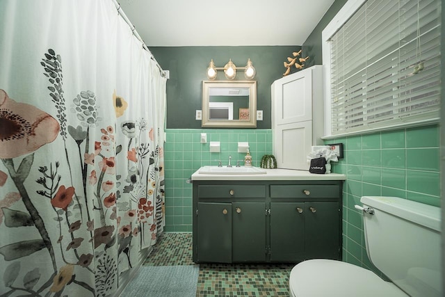 3206 Old Bainbridge Rd, Tallahassee, FL 32303 - full bath with a shower with curtain, toilet, tile walls, wainscoting, and vanity