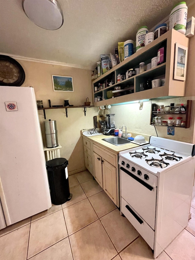 kitchen featuring ornamental molding, white appliances, a textured ceiling, sink, and light tile patterned floors