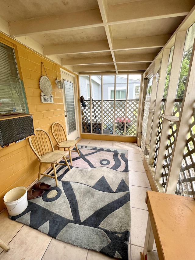 sunroom with beam ceiling