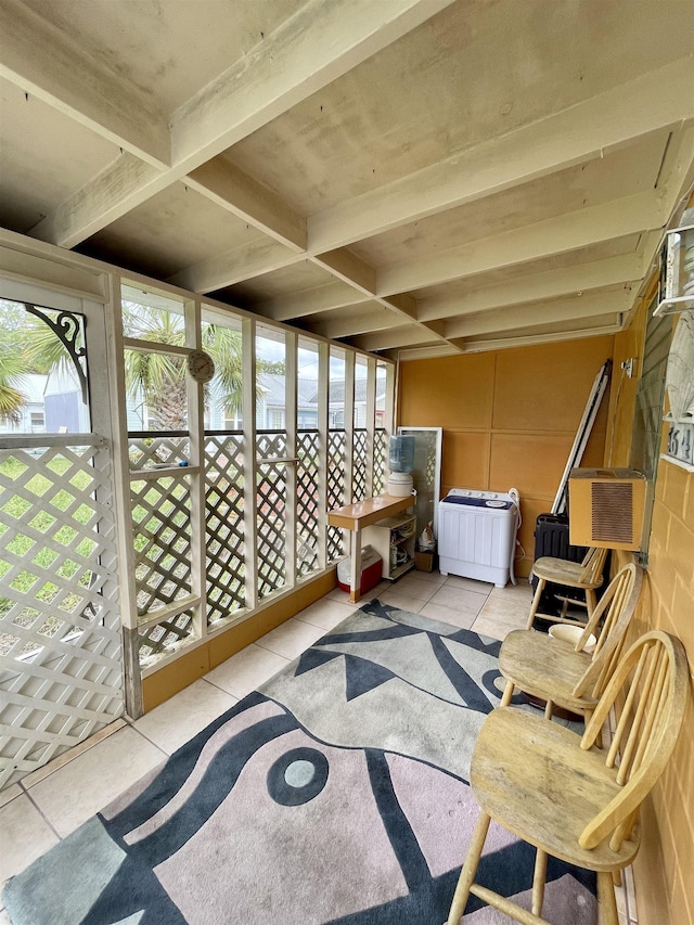 sunroom / solarium featuring beamed ceiling and cooling unit