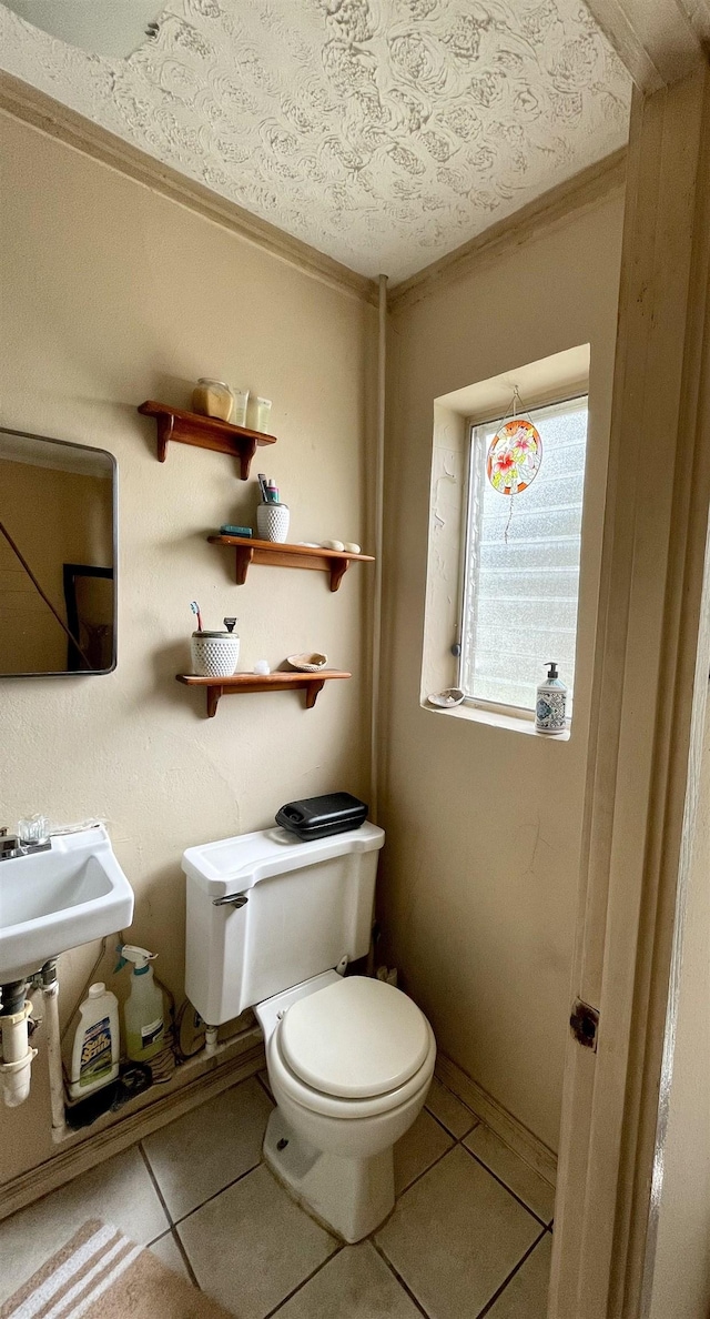 bathroom with tile patterned floors, a textured ceiling, and toilet