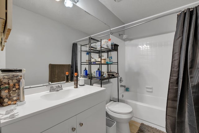 full bathroom featuring a textured ceiling, shower / tub combo with curtain, vanity, tile patterned floors, and toilet