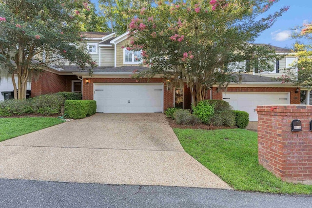 3283 Gramercy Pl, Tallahassee, FL 32308 - view of front of property with brick siding, concrete driveway, and a front yard
