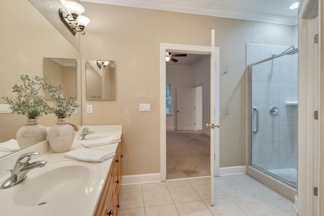 3283 Gramercy Pl, Tallahassee, FL 32308 - bathroom featuring crown molding, double vanity, a shower stall, a ceiling fan, and tile patterned floors