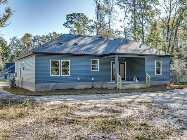 back of property featuring a porch and cooling unit