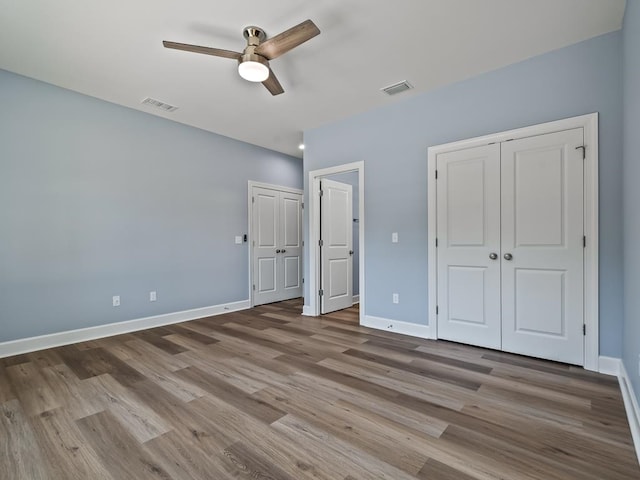 unfurnished bedroom featuring light hardwood / wood-style floors and ceiling fan