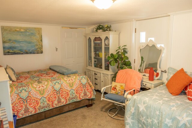 carpeted bedroom with a closet