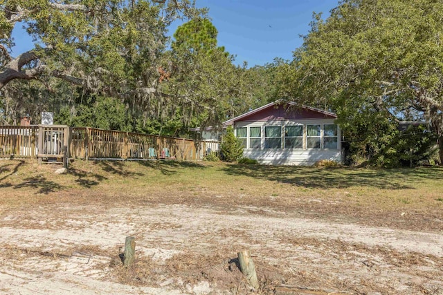 view of yard featuring a sunroom