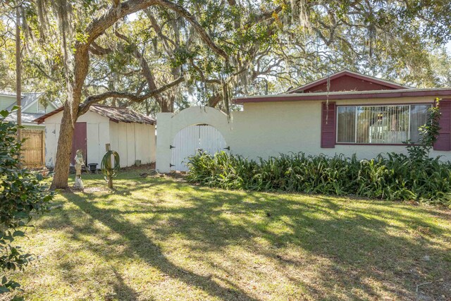 view of property exterior featuring a lawn