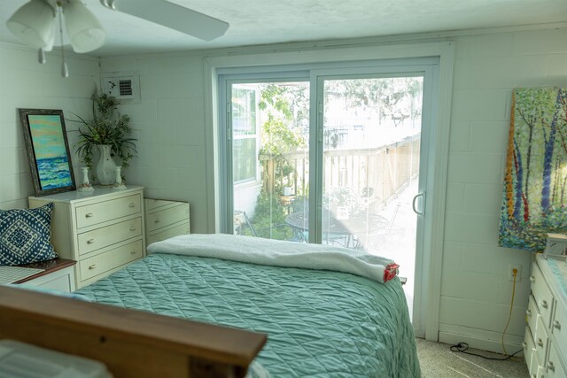 carpeted bedroom with a textured ceiling and ceiling fan