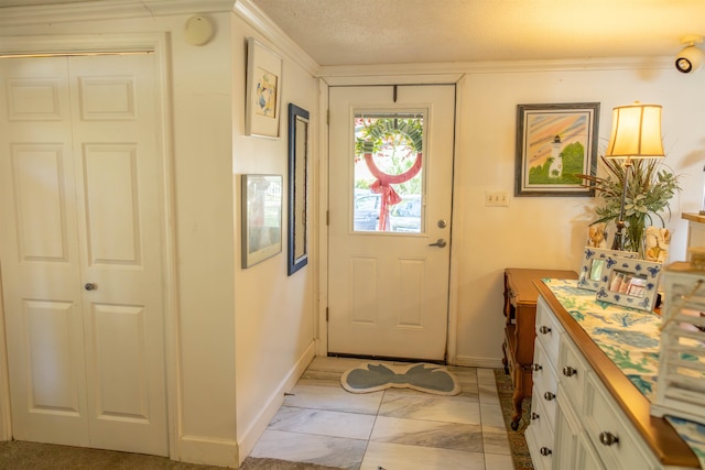 entryway featuring a textured ceiling and crown molding