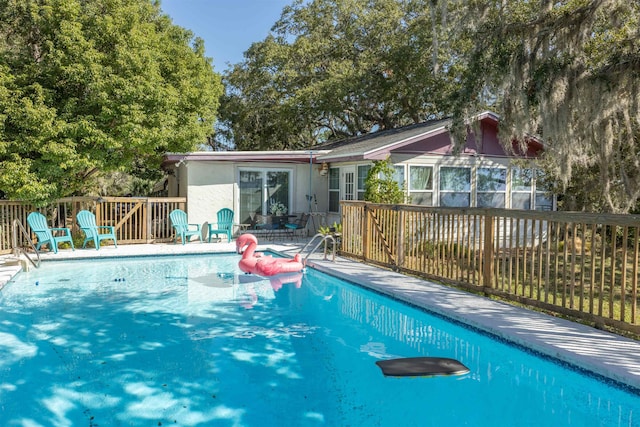 view of pool with a wooden deck