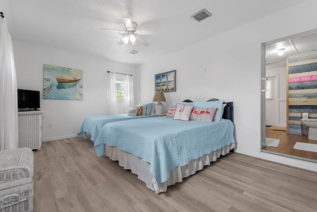 1405 SE 2nd Ave, Steinhatchee, FL 32359 - bedroom with light wood-style flooring and ceiling fan