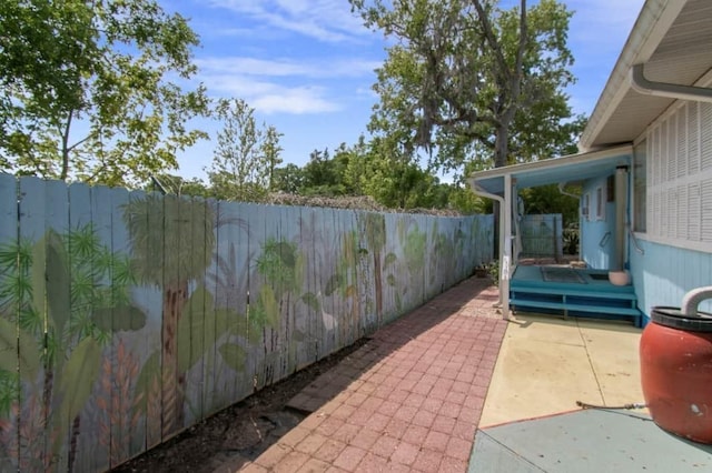 1405 SE 2nd Ave, Steinhatchee, FL 32359 - fenced backyard with a patio