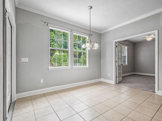 unfurnished dining area with ceiling fan with notable chandelier, light colored carpet, and crown molding