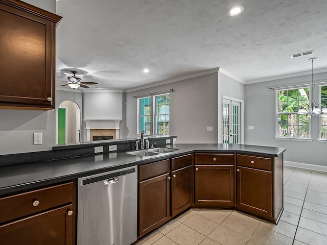 kitchen with dishwasher, kitchen peninsula, sink, and plenty of natural light