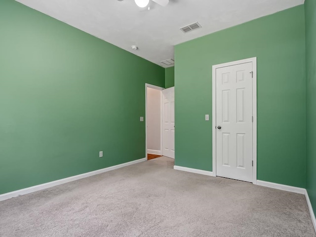 unfurnished bedroom featuring carpet floors and ceiling fan