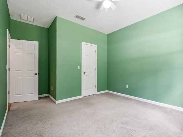 unfurnished bedroom featuring carpet floors, ceiling fan, and a closet