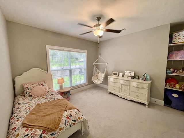 bedroom featuring ceiling fan and carpet