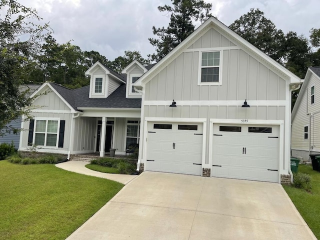 view of front facade featuring a garage and a front lawn