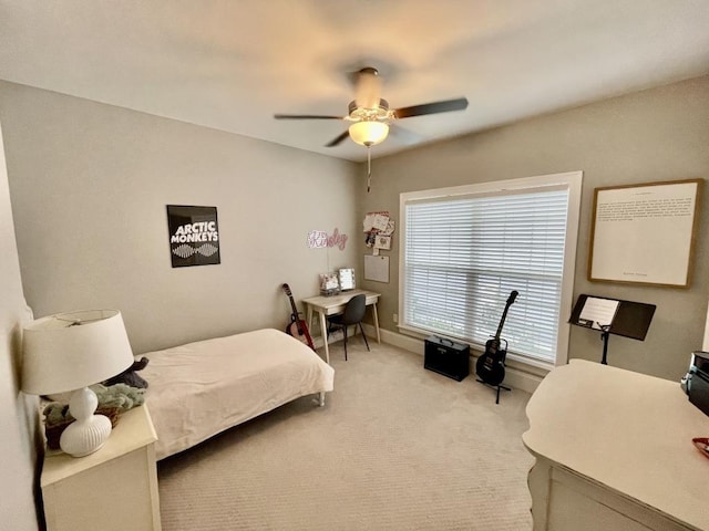 carpeted bedroom featuring ceiling fan