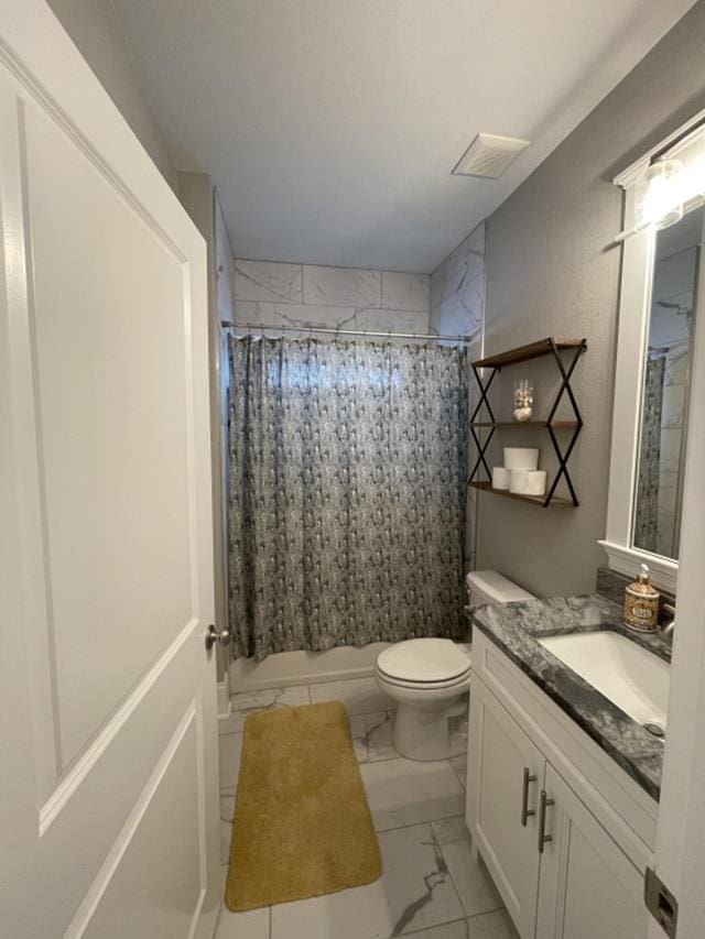 bathroom featuring vanity, toilet, and a shower with shower curtain