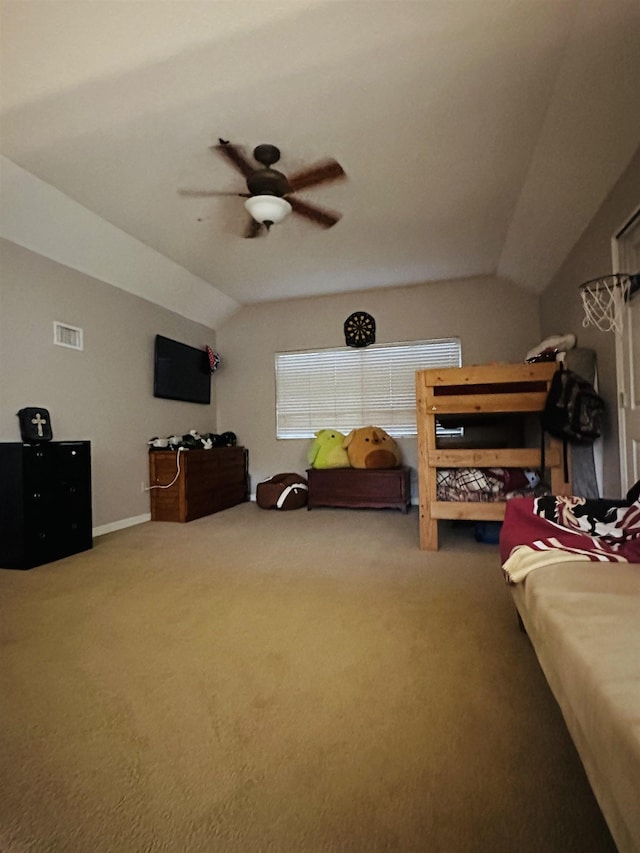 bedroom featuring carpet flooring, vaulted ceiling, and ceiling fan