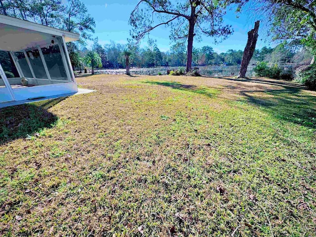 view of yard featuring a sunroom