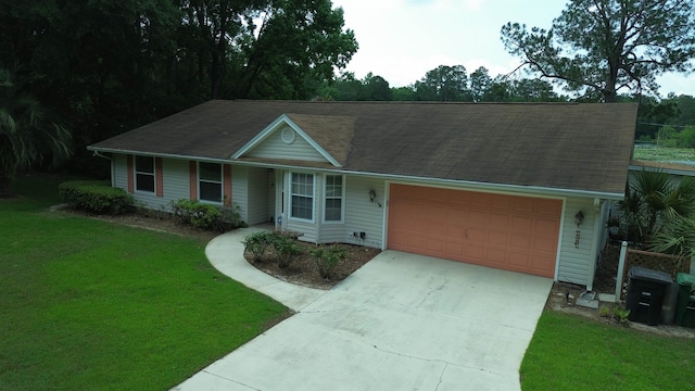 single story home with a garage and a front lawn