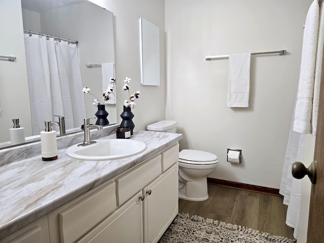 2840 Blair Stone Ct, Tallahassee, FL 32301 - full bath with wood finished floors and vanity