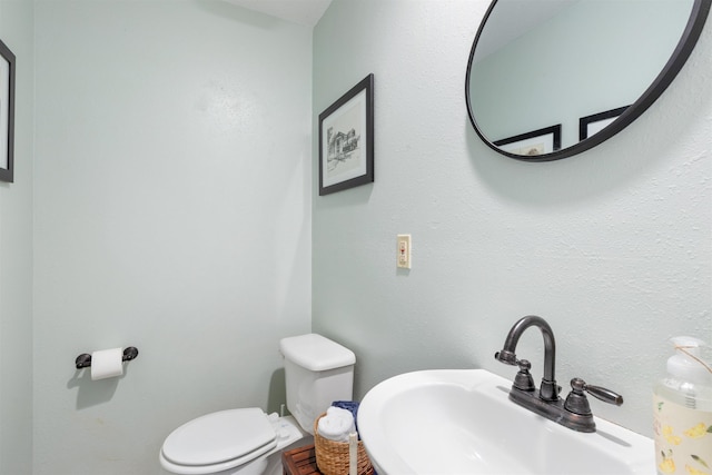 bathroom with sink and toilet