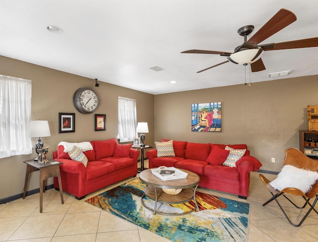 living room with light tile patterned floors and ceiling fan