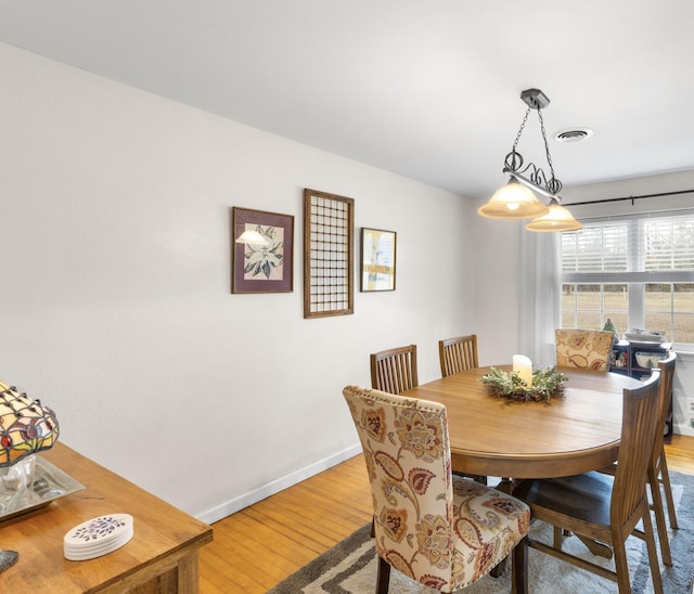 dining room featuring wood-type flooring