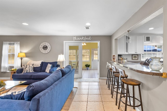 living room featuring light tile patterned flooring