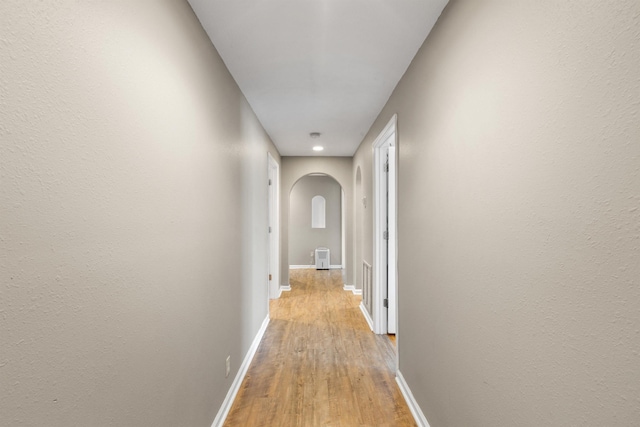 corridor with light wood-type flooring