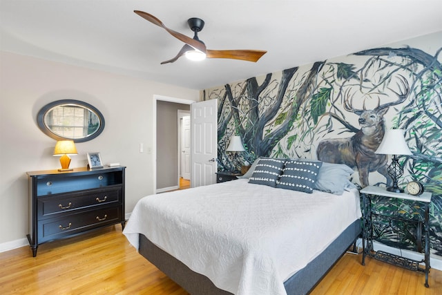 bedroom with ceiling fan and light wood-type flooring