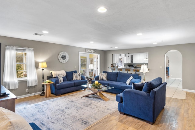 living room with light hardwood / wood-style floors