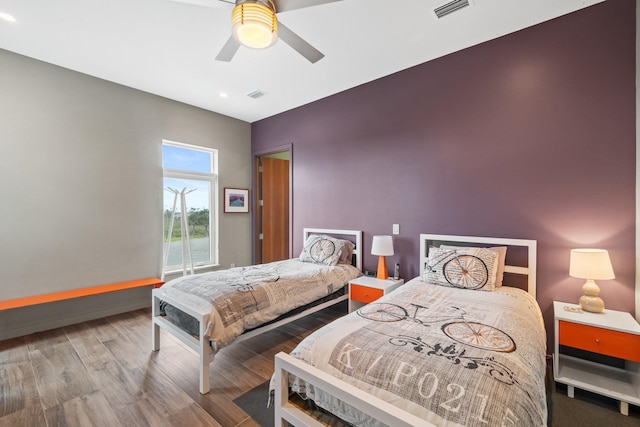 bedroom with hardwood / wood-style flooring and ceiling fan