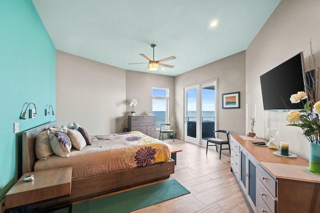 bedroom with ceiling fan, light hardwood / wood-style flooring, and access to outside