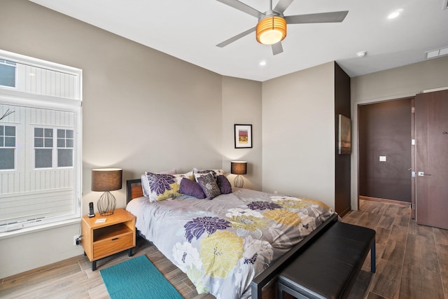 bedroom featuring hardwood / wood-style floors and ceiling fan