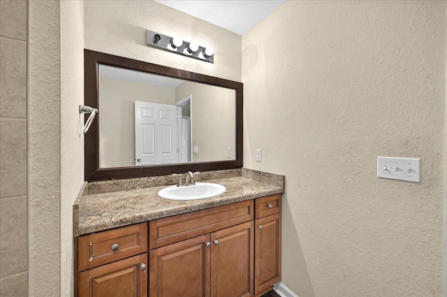 3974 Paeonia Ct, Tallahassee, FL 32305 - bathroom featuring a textured wall and vanity