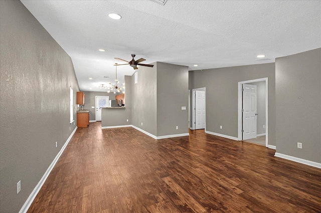 3974 Paeonia Ct, Tallahassee, FL 32305 - unfurnished living room with a chandelier, dark wood-type flooring, recessed lighting, baseboards, and ceiling fan