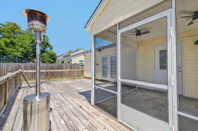 3974 Paeonia Ct, Tallahassee, FL 32305 - deck with ceiling fan, fence, a sunroom, and french doors