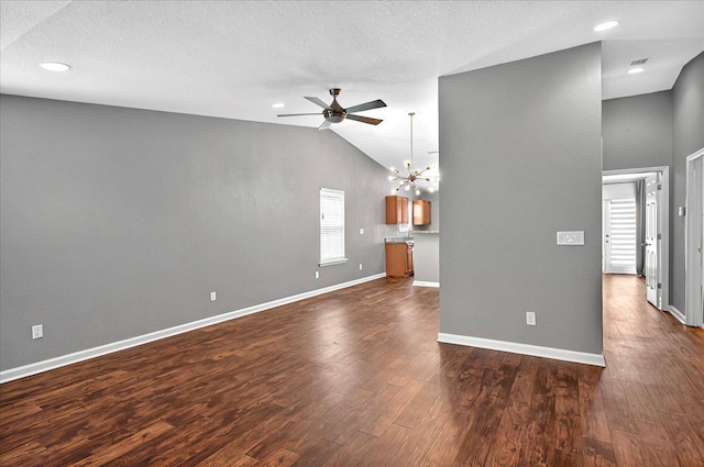 3974 Paeonia Ct, Tallahassee, FL 32305 - unfurnished living room with a ceiling fan, lofted ceiling, a chandelier, dark wood-type flooring, and baseboards