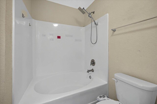 3974 Paeonia Ct, Tallahassee, FL 32305 - bathroom featuring toilet,  shower combination, and a textured wall