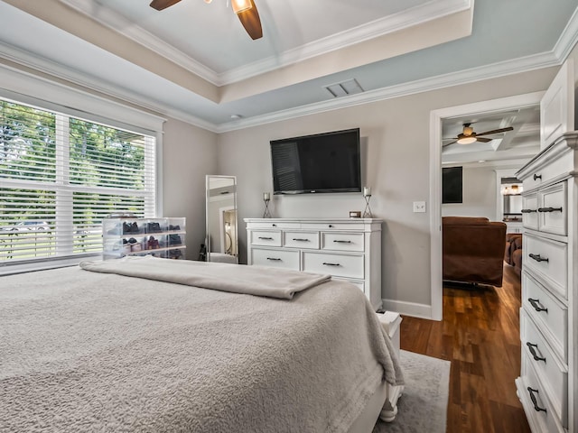 103 Pan Cera Dr, Crawfordville, FL 32327 - bedroom featuring dark wood-style floors, a tray ceiling, ornamental molding, and ceiling fan