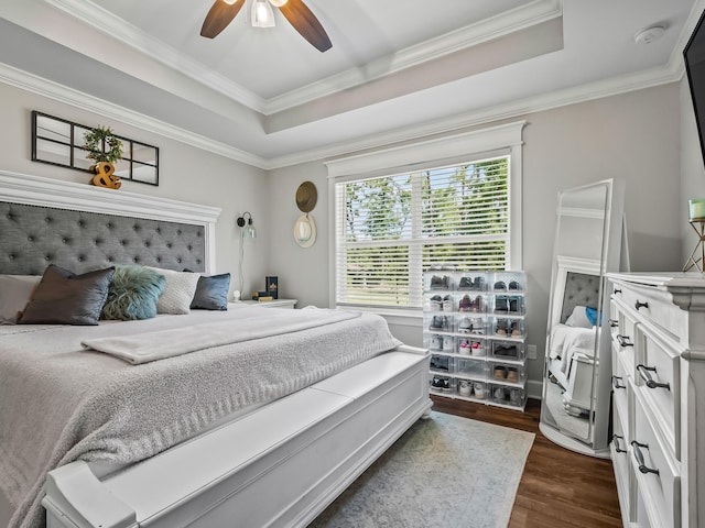103 Pan Cera Dr, Crawfordville, FL 32327 - bedroom featuring dark wood-style flooring, a raised ceiling, crown molding, and a ceiling fan